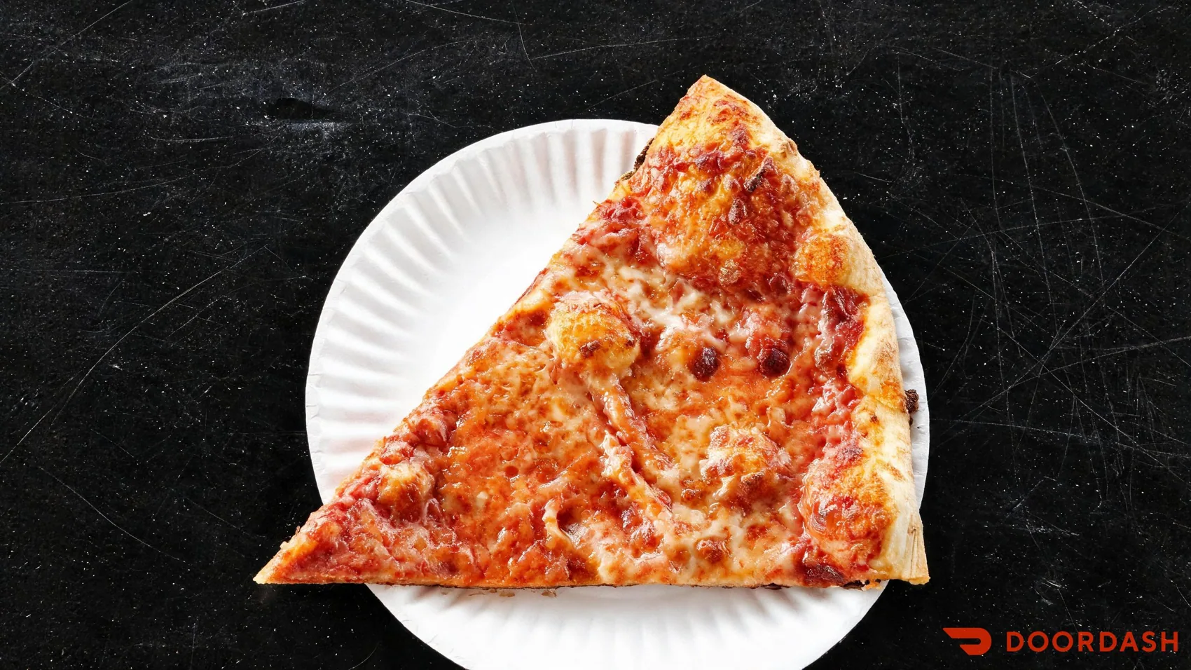 A slice of Jango's pizza